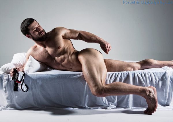 Robert Blazevic naked laying on a bed