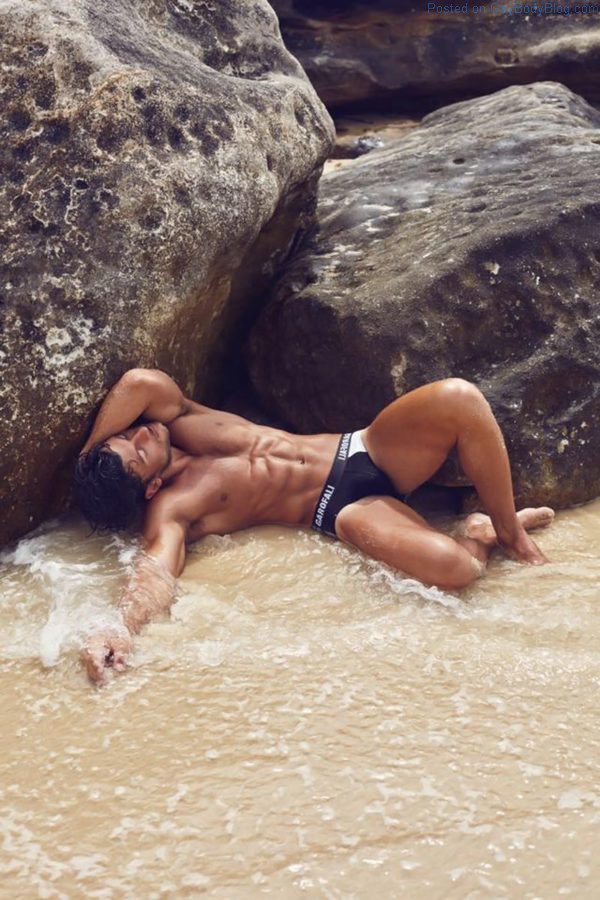 model Daniel Garofali sowing Australian jock bulge in underwear a the beach