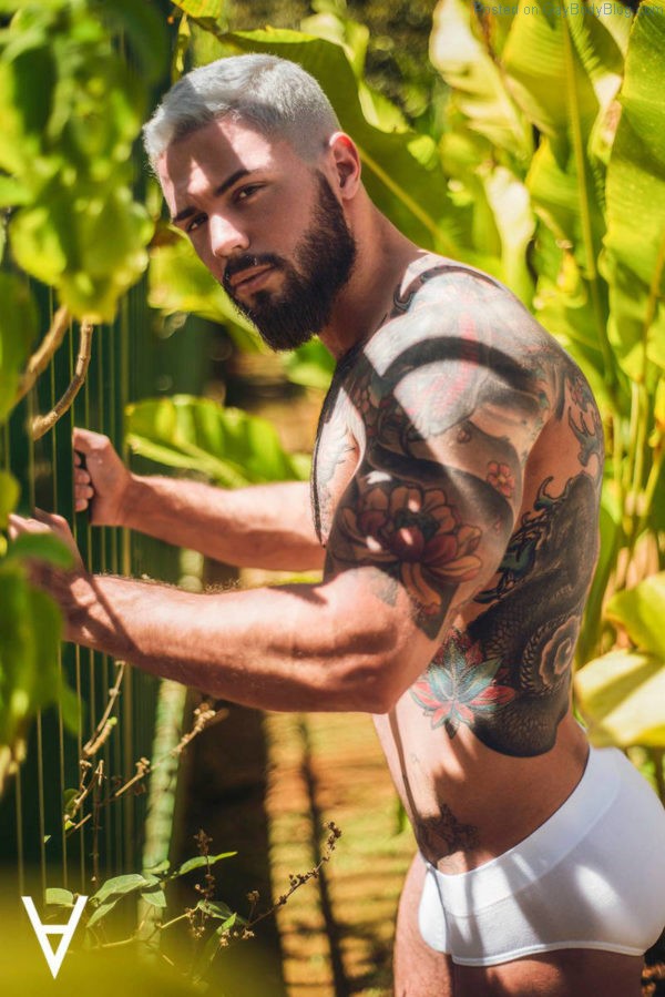 Male model Adriano Cardoso in the sun wearing white underwear