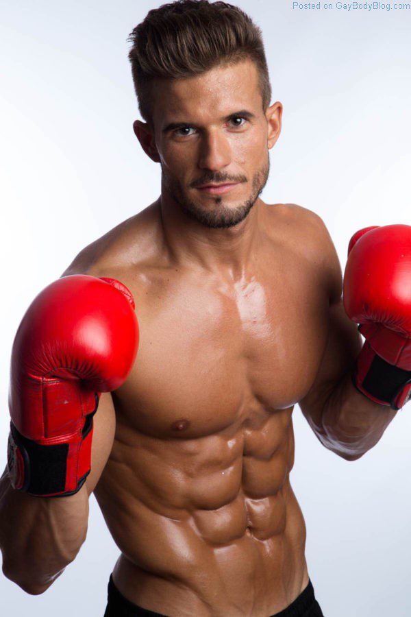 muscle man Antonio Pozo poses with boxing gloves