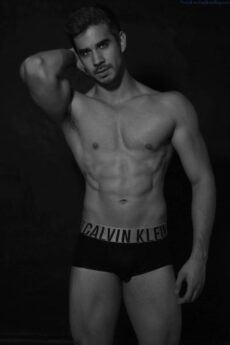 Muscled male model Eduardo Rivera standing waring only black underwear