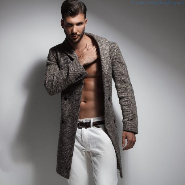 Ukrainian male model Artur Dainese showing his abs