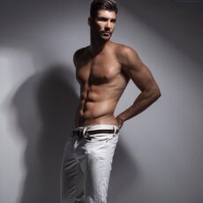 handsome male model Artur Dainese shirtless in white jeans
