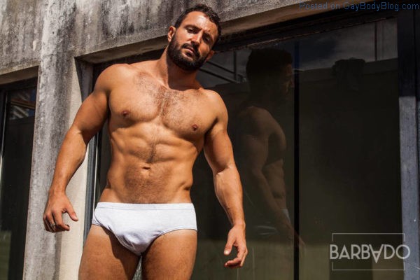 sexy hairy muscle man Claiton Rosa in white underwear in the sun