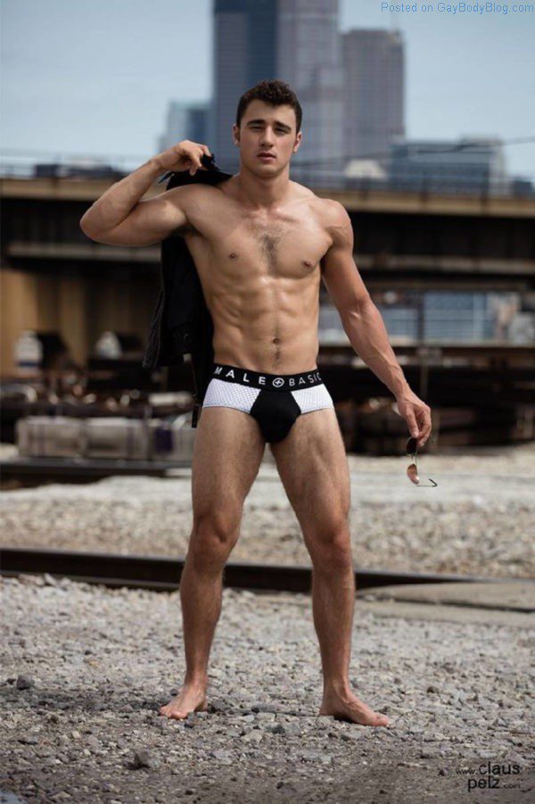 Sexy jock model Lance Syverson posing in black underwear outside