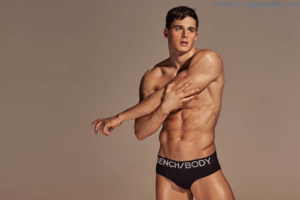 sexy male model Pietro Boselli stretching in just black underwear