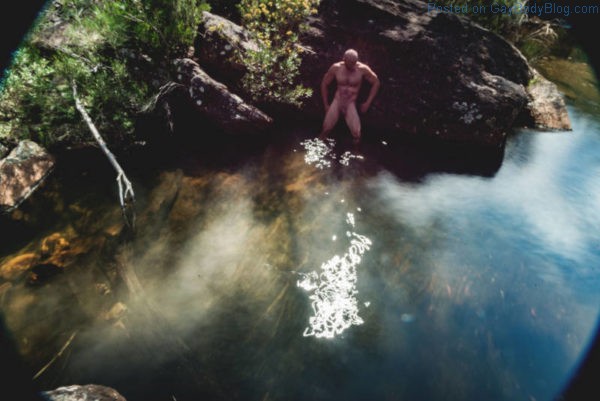 naked man in a pond