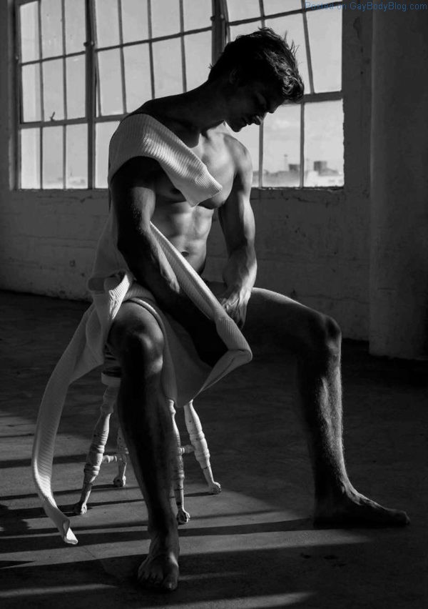 male model Aidan Anderson sitting