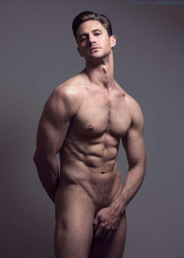 Male model Nicholas Cunningham naked and hiding his manhood behind his hand