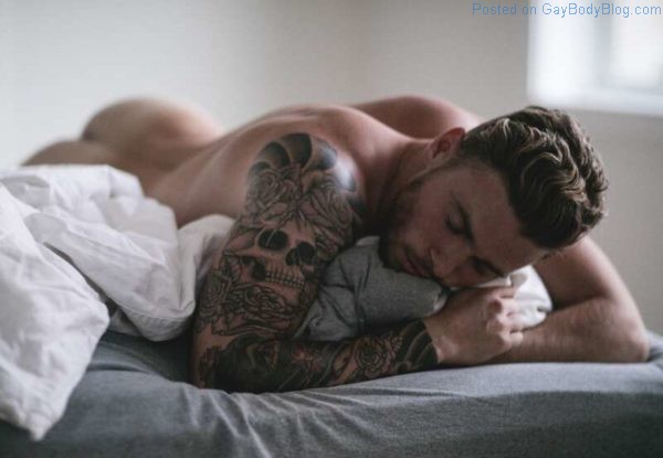 Skier Gus Kenworthy naked laying on a bed and showing his ass