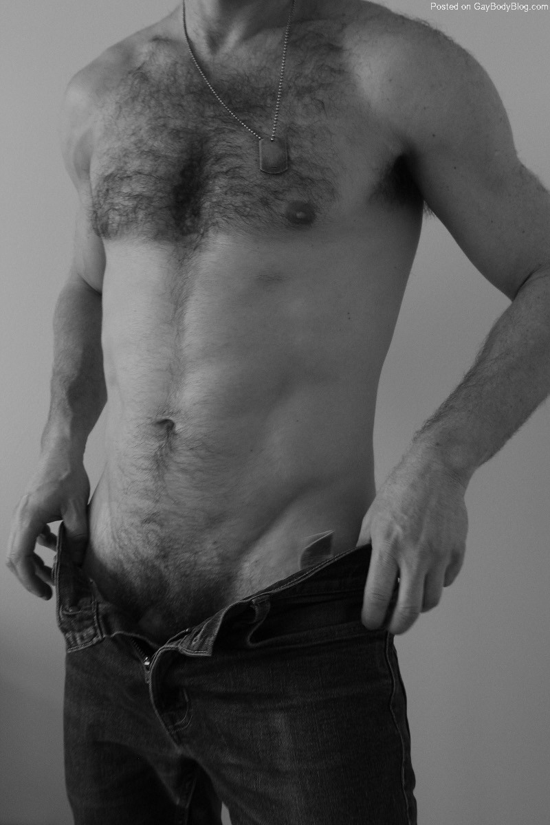 Hairy man with unzipped jeans