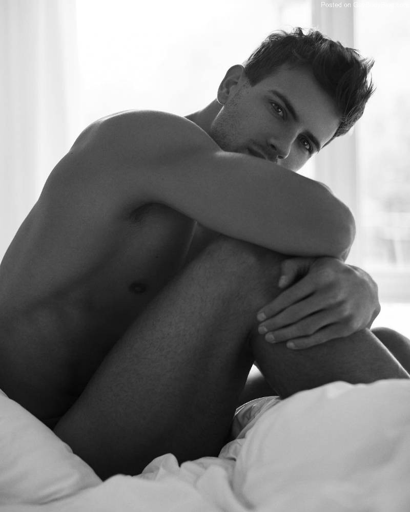 Alex Sewall naked in bed