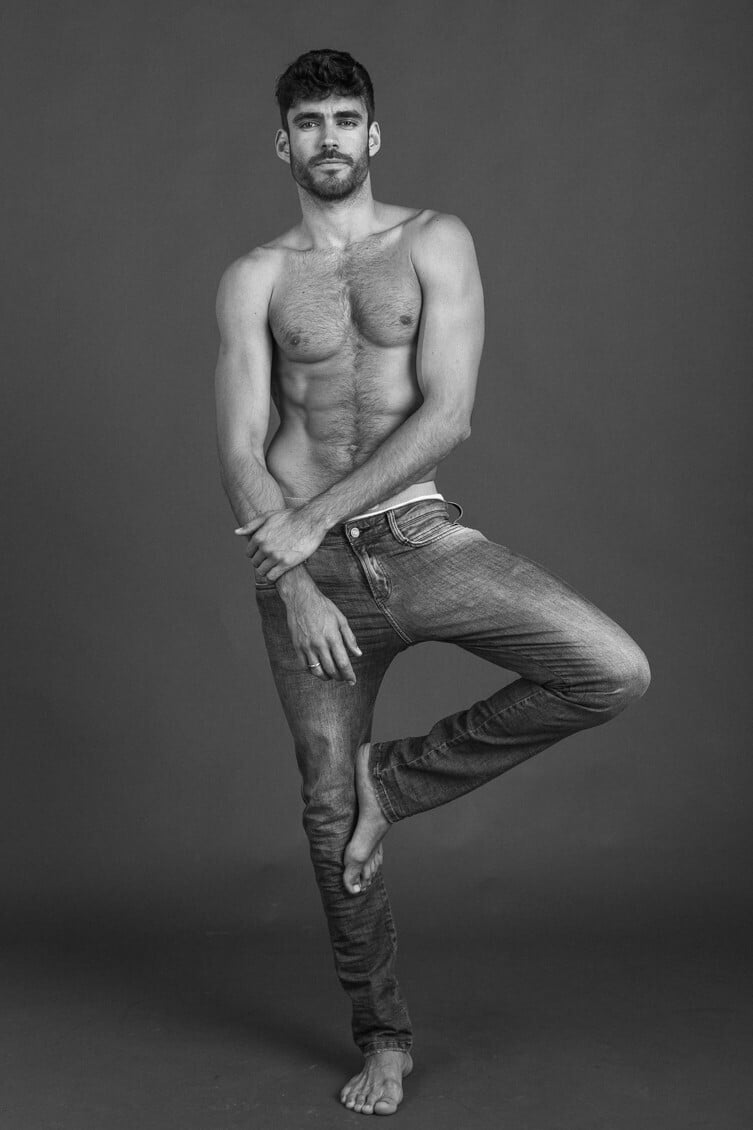 male model Caio Cesar posing in black and white shirtless and wearing only jeans