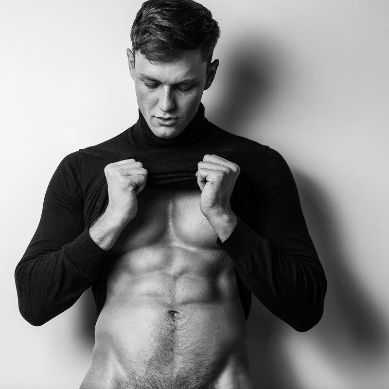 handsome male model Laurent Marchand showing his abs