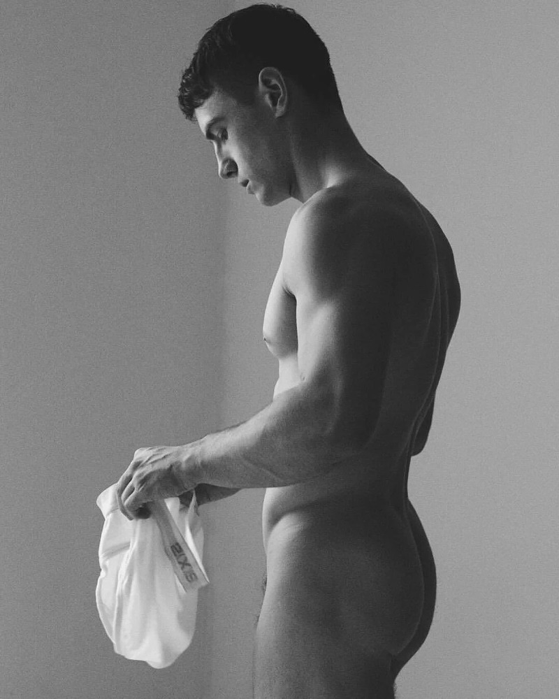 male model nude and holding while underwear