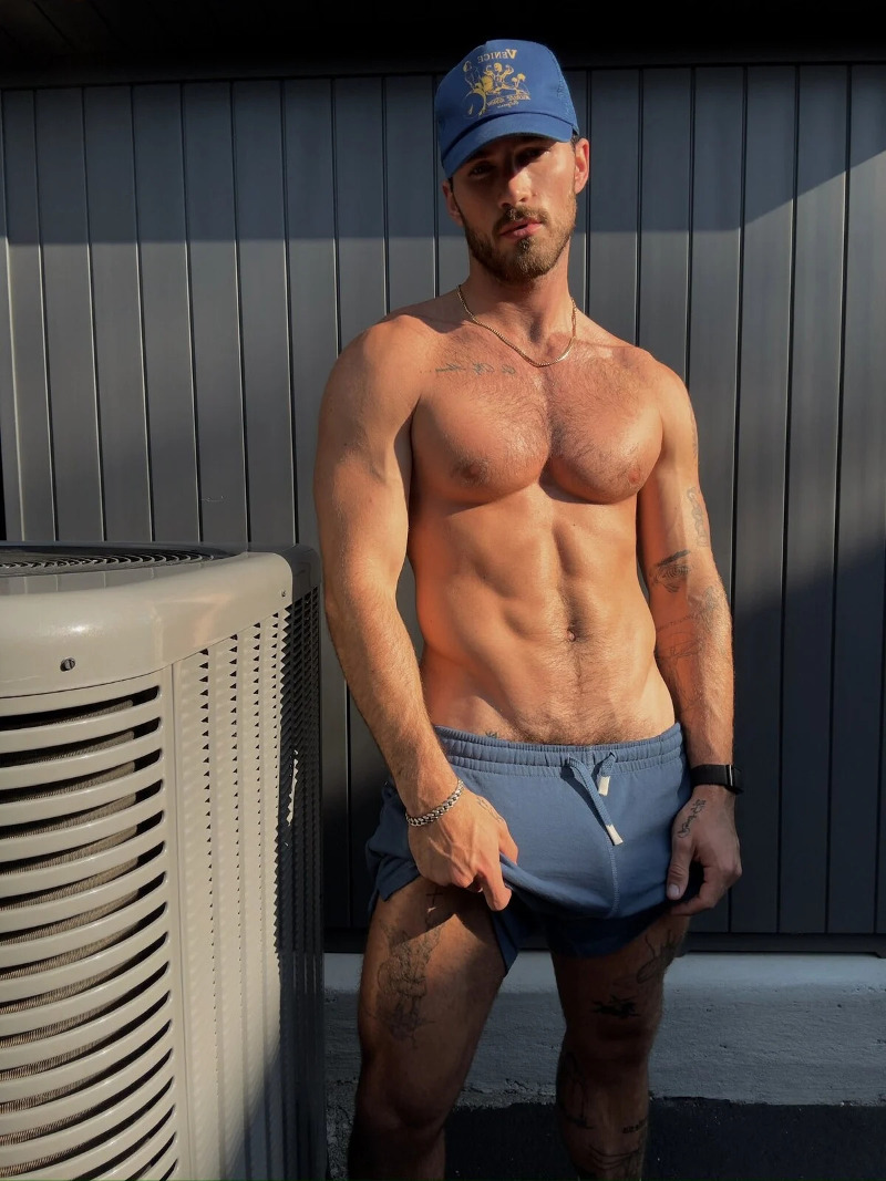 handsome and hung Michael Yerger teass with his big package in stretchy shorts