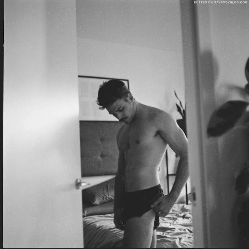 handsome male model in shorts black and white